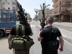 gunrunnerhell:  Afternoon walk… Two Sunni gunmen stand in the