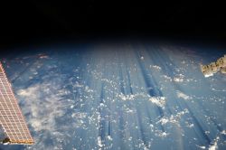 just–space:  Clouds casting thousand-mile shadows when