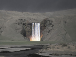 nobodyiswatchingus: Waterfall amidst a mountain covered in ash