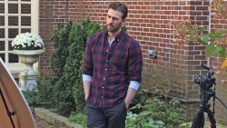 Chris Evans in a plaid shirt and henley top, with the sleeves