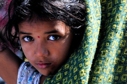 Young loneliness in her eyes | Nashik | India by Daniele Romeo