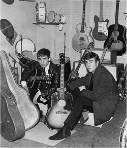 theswinginsixties:  George Harrison and John Lennon  “I