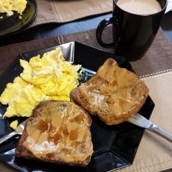 Cinnamon French Toast topped with peanut butter and scrambled