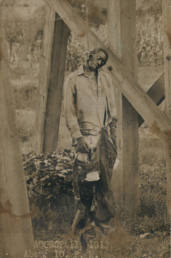 historynet:  Photo postcard taken at lynching of black man, unknown
