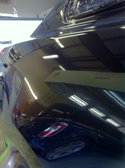 The quarter panel of a 2012 mustang I just painted
