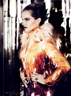 Emma Watson rocking her short hair for Vogue.