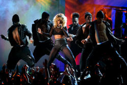 Rihanna performs at The 54th Annual Grammy Awards at Staples