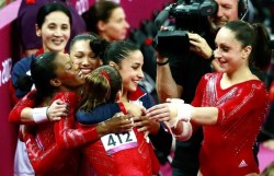 The USA Women’s Gymnastics Team celebrate after winning gold