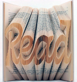 showslow:  Artist Isaac Salazar takes outdated text books and