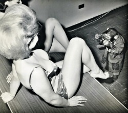 Chimpanzee photographing swimsuit models. Circa 1960′s.