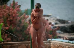 mixedgendernudity:  Nudist mom is enjoying a nice shower at the beach