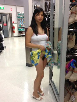chinesewife:  Flash her pussy at k-mart, she so nervous but loving the guys staring at her tits and feeling nothing under her tiny skirt.    Wow that seems exciting