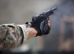 gunrunnerhell:  Brass… Sgt. Timothy Hippler, a point man with force reconnaissance platoon, shoots a .45-caliber pistol during close quarter tactics shooting at Kaneohe Bay range training facility, May 13. Capt. Brian VanHoose, the platoon commander