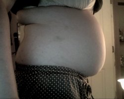 veganpiggyprincess:  After stuffing! My belly is so tight and heavy ^.^