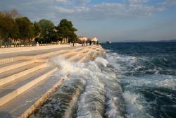 juipiter:  coolthingoftheday:  The Sea Organ is an experimental musical instrument that is located in Zadar, Croatia. Beneath the white marble steps, a series of tubes create a system that could be described as a large piano. When the waves or the wind