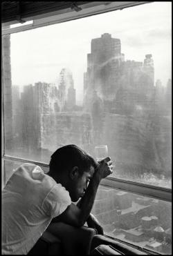 semioticapocalypse: Burt Glinn. Sammy Davis Jr. looks out of a Manhattan window. New York, 1959  [::SemAp Twitter || SemAp::] 