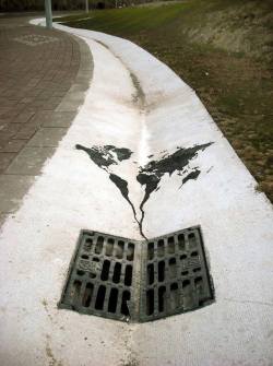 Going down the drain (street art by Pejac)