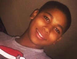 iwriteaboutfeminism:  This is 12 year old Tamir Rice, who was shot and killed by a police officer in Cleveland for holding a toy gun. Know his story. Remember his name. 