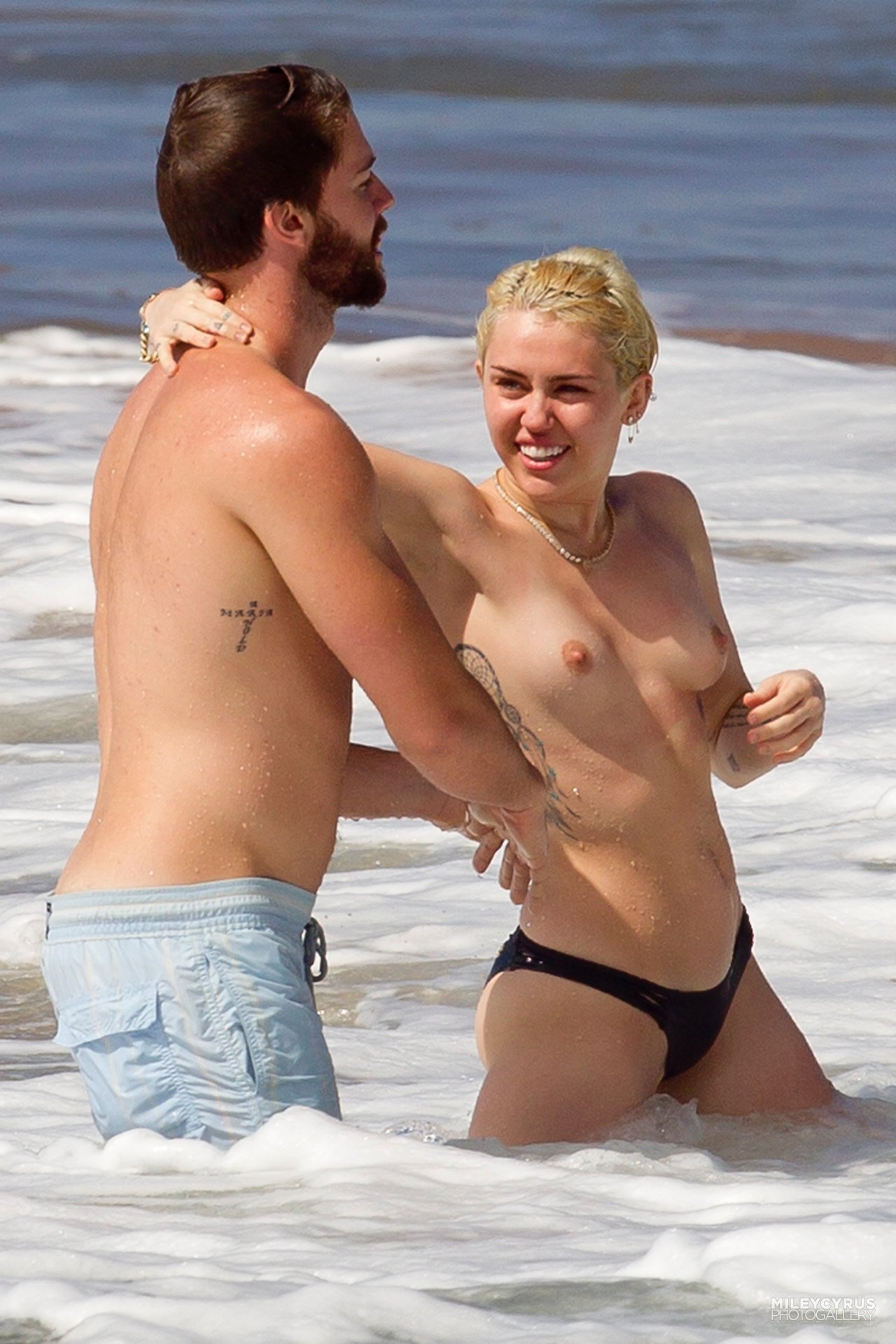 toplessbeachcelebs:  Miley Cyrus (Singer) swimming topless in Hawaii (January 2015) -