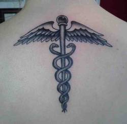 reddlr-tattoos:  Caduceus by Shannon Young in Tallahassee, FL
