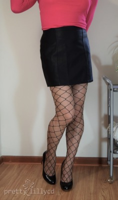 prettylillycd:  Bringing out the big net!I know it has been awhile, I thought I would give you reminder of what my legs look like! Oh… and a glimpse of my new faux leather skirt!