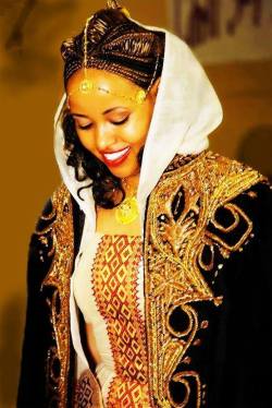 kemetic-dreams:    From Northern Ethiopia…A beautiful Tigrai bride wearing a traditional wedding dress. The black coat is called Kabba. Northern Ethiopia is rich in culture and art  https://www.youtube.com/watch?v=Hu0z6zyc2J8