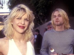 nirvananews:  &ldquo;Sorry about this zit..&rdquo; - Courtney Love says, wearing an engagement ring from 1906 with a ruby centered in the middle.&ldquo;Zits are beauty marks.&rdquo; - Replies Kurt Cobain.Read More on The Love/Cobain Relationship.