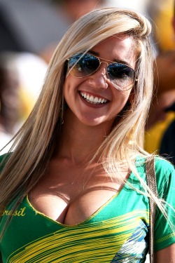 sportalaustraliaphotos:  A Brazil fan smiles before the Opening Ceremony of the 2014 FIFA World Cup Brazil prior to the Group A match between Brazil and Croatia at Arena de Sao Paulo on June 12, 2014 in Sao Paulo, Brazil.  (Photo by Warren Little/Getty