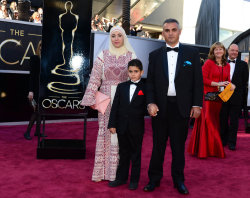 themindislimitless:  badassmuslimahs:  Emad Burnat and his wife Soraya representing Palestine (Nominated for ‘5 Broken Cameras’) at the Oscars. Soraya is wearing a traditional Palestinian Thob.  They were also completely disrespected by us customs
