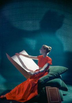 bookpatrol:  Model holding large folio wearing two-piece hostess gown with bare midriff from Adele Simpson, 1944Photo by Cecil Beatonvia