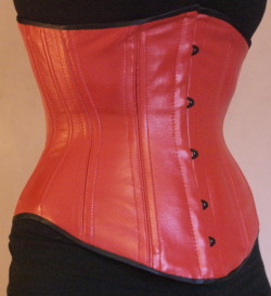 thelittlebluegem:  Red Leather Underbust with Black Metal This corset is made with real nappa leather, a gorgeous soft leather commonly used for jackets and other similar leather garments. It is reinforced with a strength layer of cotton coutil and is
