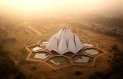 ultimate-passport:  Lotus Temple - Delhi, India    A holy place of worship for followers of the Bahá'í Faith, the Lotus Temple has won numerous architectural awards, making it one of the most recognisable buildings in India. Like all other Bahá'í