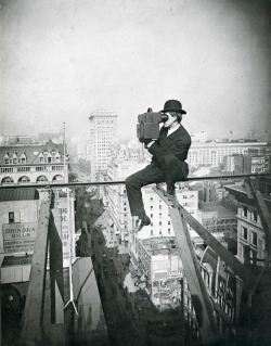 Charles C. Ebbets takes a photo from atop a skyscraper in New York City, 1905.