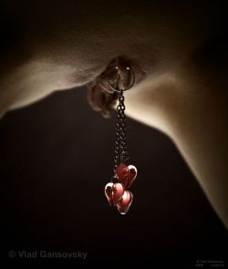 blueskinkyplayground:  I have never wanted my labia pierced, but these hearts are so beautiful and sexy.  ~Blue~  Photo by Vlad Gansovsky 