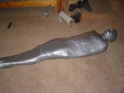 lovingair:  Such a peaceful mummy.  Look at all that left over plastic wrap… 