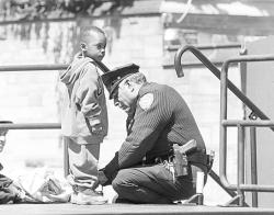 sararye:  todd76:  While taking a routine vandalism report at an elementary school, an officer was interrupted by a little boy about six years old. Looking up and down at his uniform, he asked, “Are you a cop?” “Yes,” he replied and continued