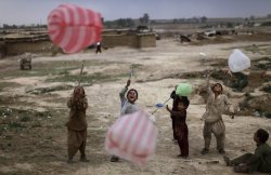 letswakeupworld:  Children play with plastic bags in a slum area on the outskirts of Islamabad, Pakistan.