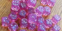 Saw some people flaunting their dice collections so I thought I&rsquo;d share. Got these recently for shadowrun (a troll&rsquo;s gotta roll his resistance dice~)  For people wondering they are Chessex Pink w/ Silver Borealis dice, you can probably find
