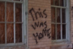 irlpunk:  what’s weird about this writing is the fact that i took this at an abandoned mental hospital and someone spray painted “this was home” and the story behind the writing could be endless 