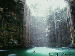 koolaidicecubes:  ashley-gold:  still kind of in disbelief that I actually took this picture. The sinkhole’s water was 150 feet deep and had a ledge that you could dive off of from halfway up. Probably the best experience of my life.  Ashley omfg this