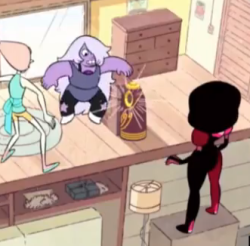 wearethecrystalfems:  I’d just like to point out that Garnet is freaking standing on a bookshelf (or something) that is all.   OH, that makes sense. I thought it was weird she could see up there because, yea, she&rsquo;s really tall but she&rsquo;s