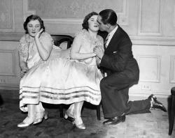  Margaret Gibbs gets a kiss from her betrothed, while her conjoined sister Mary looks on awkwardly, 1940s (via) 