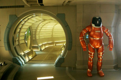 interface-2037:P R O M E T H E U SThe orange exo suits to appear on screen were not meant to be worn. They were built for decorative purposes only. The two suits are now displayed in an apartment and a private office, both owned by Ridley Scott himself.