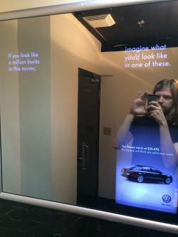 nickgoeshere:Here’s an example of sexism in the media. It’s very subtle, but it’s insidious, and it’s everywhere. Men’s washroom and women’s washroom, each with an ad in the mirror. Both ads are for the same car. However, the text is slightly