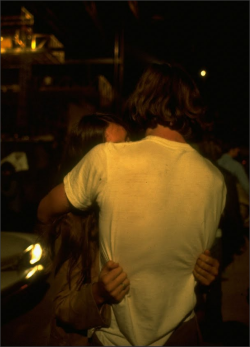 1950sunlimited:Young Couple seen from the back kissing at night at Woodstock, 1969Bethel, New YorkJohn Dominis