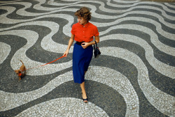natgeofound:  A woman walks a dachshund across pavement with undulating wave patterns in Rio de Janeiro, Brazil, March 1955.Photograph by Charles Allmon, National Geographic