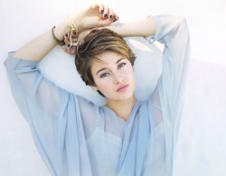 shailene-theodaily:  Shailene Woodley in Bust magazine in 2014.  The pastel blue color really suits Shailene.  Not to mention Shailene wearing a flower crown with a nature backdrop is right in her element. 