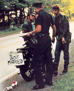 cesoirvert:  lgbt-history-archive:  “JUST MARRIED,” Fernando, seated, and his husband, both members of Los Angeles’ Blue Max Motorcycle Club, get pulled over as they leave their wedding ceremony, December 1969. Photo c/o @onearchives. In the mid-twentieth