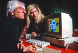 In 1985, Andy Warhol who was intrigued by the potential of computer-assisted art agreed to be a spokesperson for Apple’s rival in the personal computing sphere—#Commodore. The artist was to promote the company’s new computer, the #Amiga 1000, and