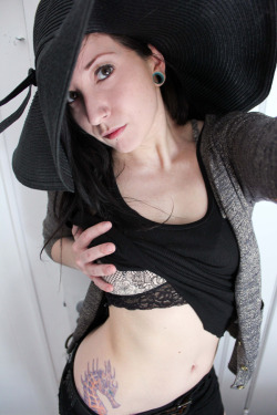 cherry bella shows off her fabulous hat, and seahorse ink. 